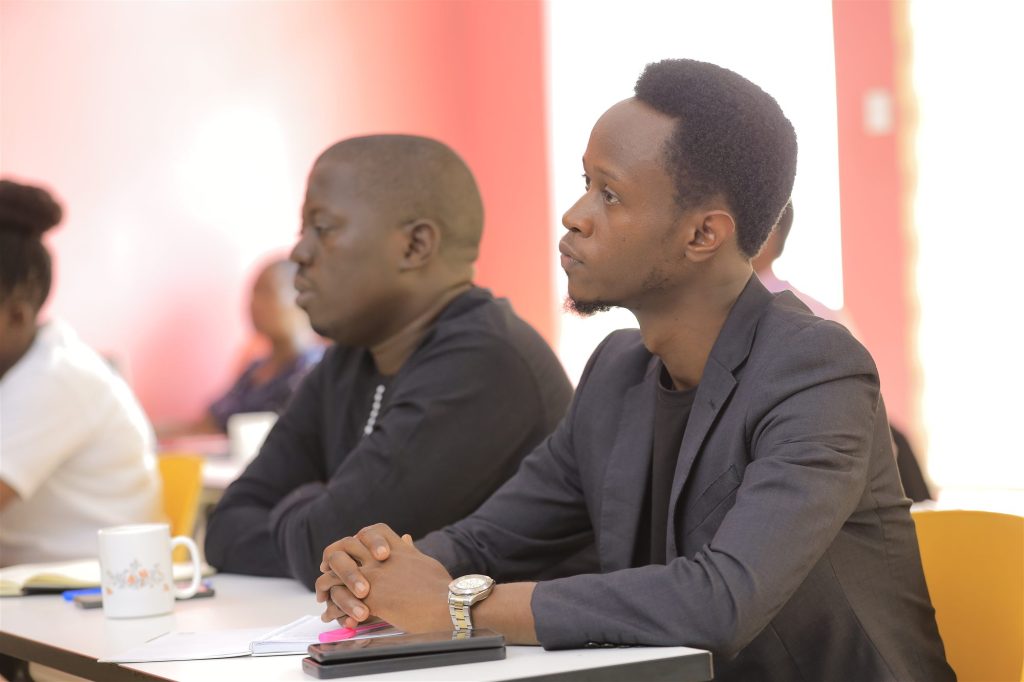 AIHS students listening attentively in a lecture